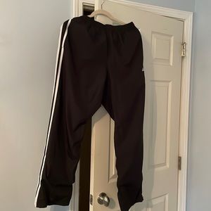 Adidas wind pants size Medium with zippers at hem and drawstring waistband